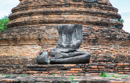 Aytthaya, Thailand, 22 Aug 2020 : Ancient old buddha statue sculpture is damaged at the old temple in Ayuthaya province, thailand. Selective focus.のeditorial素材