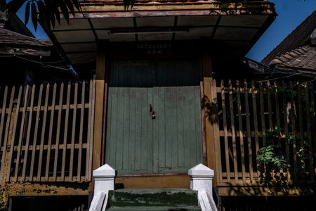 Traditional Thai style wooden door and terrace, The traditional house, Light and Shadow.の写真素材