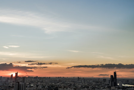 Gorgeous panorama scenic of the sunrise with cloud on the orange sky over large metropolitan city in...