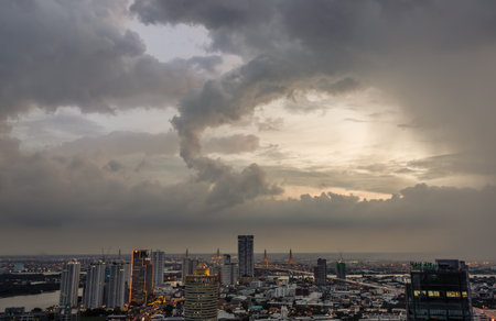 Bangkok, thailand -Sep 17, 2021 : Fantastic colorful sunset sky over the bangkok city skyscrapers and the Bridge crosses the Chao Phraya river with bright glowing lights at dusk give the city a modern style. Copy space, No focus, specifically.のeditorial素材