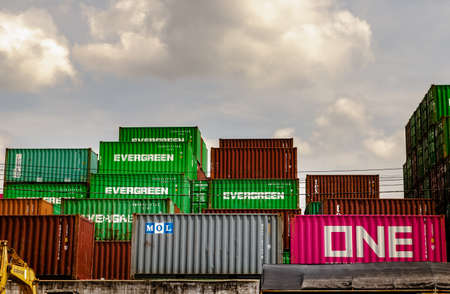 Bangkok,Thailand - May 20, 2021 : Industrial containers box for Logistic import export business concept. Stacked cargo containers in storage area. No focus, specifically.のeditorial素材