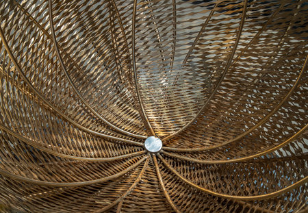 Golden steel sculpture for decorative attractive at park. Architectural structure consists of...