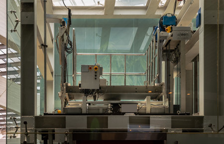 Elevator engine glass room with elevator motor. Motor driven Elevator cable control room. Wire Rope cable control the elevator. Selective focus.の写真素材