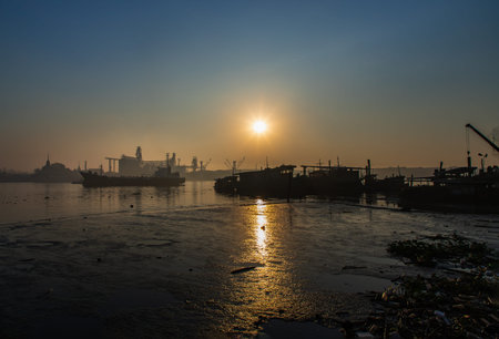 Bangkok, Thailand - Jan 10, 2022 : Gorgeous panorama scenic of cargo ship in the middle river and...