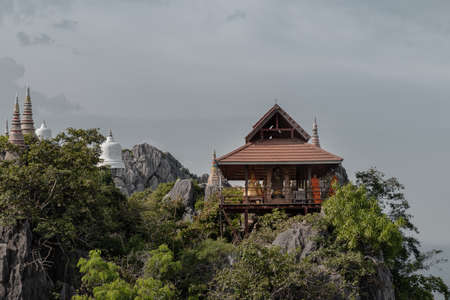 Lampang, Thailand - Sep 03, 2020 : Pagoda on top of the cliff high mountain at Chaloem Phrakiat Phrachomklao Rachanuson temple (Wat Phrabat Pu Pha Daeng) Chae-Hom District, Lampang province, Unseen and Amazing temple in Thailand. Selective focus.のeditorial素材