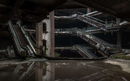 Bangkok, Thailand - 07 Feb 2022 : Damaged escalators and waterlogged in abandoned shopping mall building. Structural and ruins was left to deteriorate over time, New World Mall, No focus, specifically.のeditorial素材