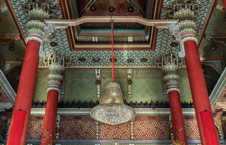 Bangkok, Thailand - Feb 10, 2020 : Architecture chinese-style temple with Decorative chandelier hanging on ceiling and Red pillars inside the Wat Bhoman Khunaram (Bhoman Khunaram Temple). Selective focus.のeditorial素材