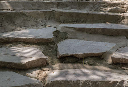 Sunbeams lighting down of stone slab at brookside. Abstract background texture, Beautiful background for wallpaper, Copy space, Selective focus.の写真素材