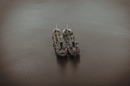 Bangkok, Thailand - 22 Mar, 2022 : Two cargo ships parked in the middle of the Chao phraya river on...