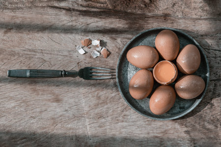 Composition of Broken fresh chicken egg (Hen egg) put at the middle of the fresh eggs with brown...