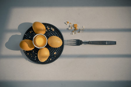 Composition of Broken fresh chicken egg (Hen egg) put at the middle of the fresh eggs with brown...