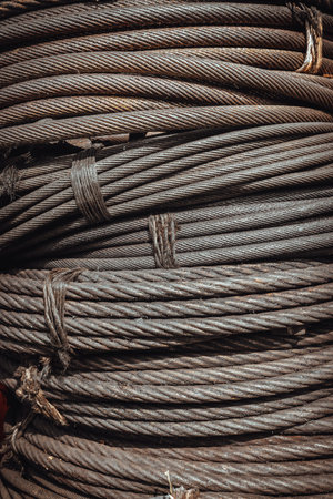 Close-up of Coil large Wire rope sling or Cable sling drum reels stocked in store. Steel wire cable...