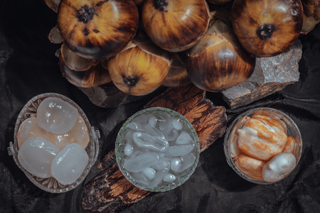 Sliced sweet fresh toddy palm with syrup and shaved ice in glass bowl. Thai Dessert call Louk Tarn Loi Gaew, Top view, Selective Focus.の写真素材
