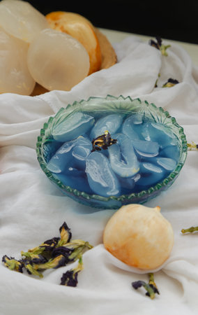 Fresh toddy palm in Blue butterfly pea syrup and shaved ice decorated with Dry butterfly pea flower...