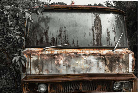 Front view Old vintage truck car wreck used to transport ore from the mine to the steelworks. Old abandoned mining truck in old mining town area, Selective focus.の写真素材