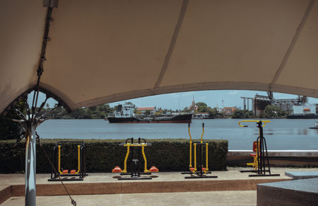 Various types of exercise equipment in the private park of condominium along the Chao phraya river....