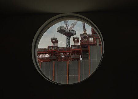 Bangkok, Thailand - 15 May 2022 : View of Building construction as seen through from round circular...