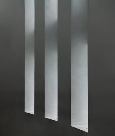 Sunlight shines through light channel of White cement wall background. Abstract interior design,...