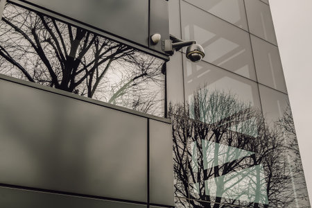 Surveillance camera for mounted on outside wall of Modern building. The concept of surveillance and...