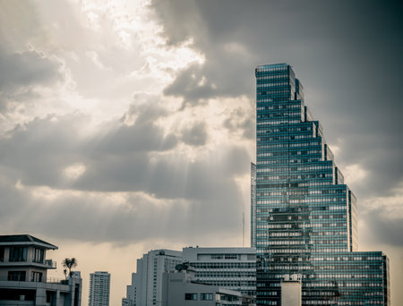 Bangkok, Thailand - 11 Nov 2022 : Architectural exterior view of modern high-rise building against the background of the sky with clouds. Space for text, Selective focus.の写真素材