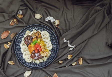 Homemade Fresh fruit cake decorated with dried red cherries, dried kiwis, dried pineapples, dried...