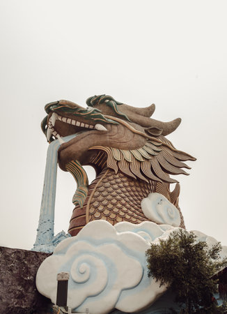 Suphan buri, Thailand Apr 22, 2023 - Dragon Descendants Museum in thailand. Big Dragon Sculpture with sky background It is Unique museum in the shape of a massive dragon situated in the City Pillar Shrine of Suphan Buri Province, showcasing Chinese historのeditorial素材