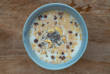 Healthy homemade malt flakes granola consists of rolled oats cashew nuts, seeds, chia seeds and...