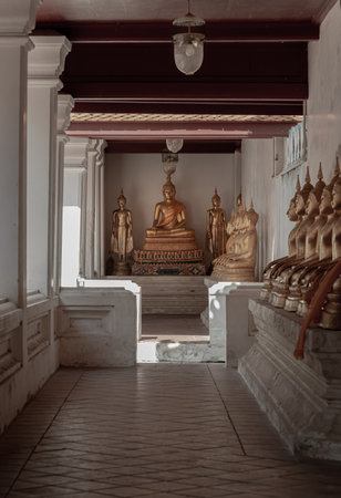 Bangkok, Thailand - May 14, 2022 - Diminishing perspective interior view at corridor around the Wat yai suwannaram temple is leading to Buddha statue. Selective focus.のeditorial素材