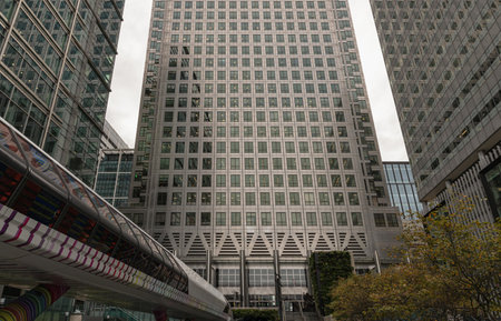 London, England - Oct 16, 2023 - Looking Up perspective of modern skyscrapers in the city view. Canary Wharf skyscrapers in major London financial centre, Architectural exterior view, Space for text, Selective focus.のeditorial素材