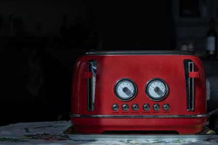 Red retro styled toaster for breakfast. Toaster in vintage style, Electric stainless steel toaster,...