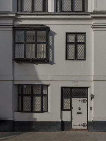 London, UK - Oct 24, 2023 - Facade of a house in De Vere Cottages and street light at South Kensington. Space for text, Selective focus.のeditorial素材