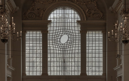 London, UK - Nov 01, 2023 - Unique warped leaded glass window at St Martin in the fields of Trafalgar square. Space for text, Selective focus.の写真素材
