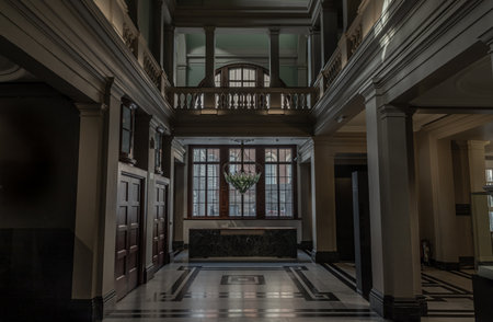 London, UK - Nov 01, 2023 - Beautiful interior architecture design. The room is Vintage dark tone to reveal the primacy of the central structure with âExhaleâ the worldâs first living bionic chandelier which purifies the air indoors of Victoria and Albert Museum.の写真素材
