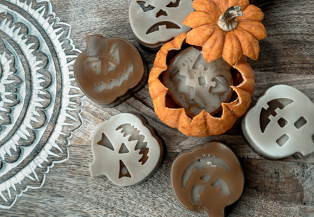 Delicious pumpkin ghost made with Agar powder in Halloween pumpkin. Tasty jelly in the shaped of cute ghost pumpkin. Celebrate with Halloween holiday, Pumpkin demon, Top view, Space for text, Selective focus.の写真素材