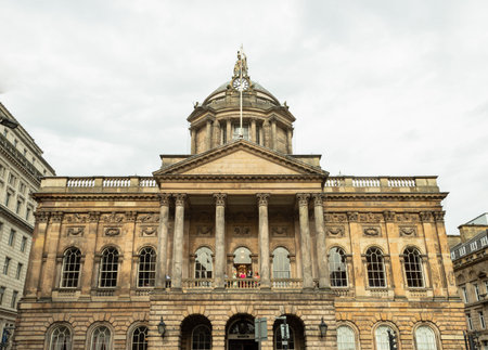 Liverpool, UK - Oct 07, 2023 - People come to the wedding ceremony in Liverpool Old town Hall buildiing. View from Castle Street. Exterior view of Liverpool Council, Georgian architecture, Copy space, Selective focus.のeditorial素材