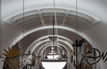 London, UK - Nov 27, 2023 - Perspective of interior architecture design lamps of The Victoria and Albert Museum. Inner decor, Space for text, Selective focus.のeditorial素材