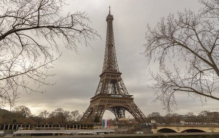 France, Paris - Jan 4, 2024 - Nice scenery of Eiffel Tower and Seine River in Paris at Afternoon....