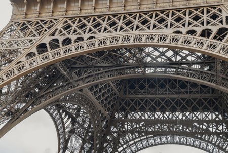 France, Paris - Jan 4, 2024 - Architectural detail design of the famous Eiffel Tower iron structure. Close-up of the framework of the Eiffel Tower in Paris, France, Space for text, Selective focus.のeditorial素材