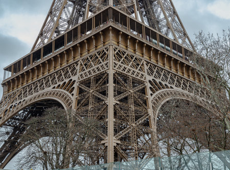 France, Paris - Jan 4, 2024 - Architectural detail design of the famous Eiffel Tower iron structure....