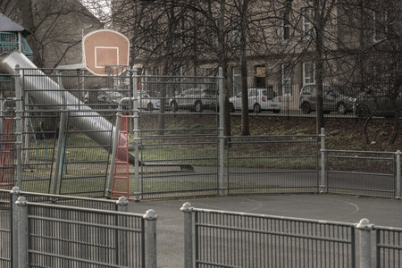Edinburgh, Scotland, Jan 19, 2024 - Basketball backboard with the hoop metal ring in outdoor basketball courts at the city downtown. Space for text, Selective focus.の写真素材