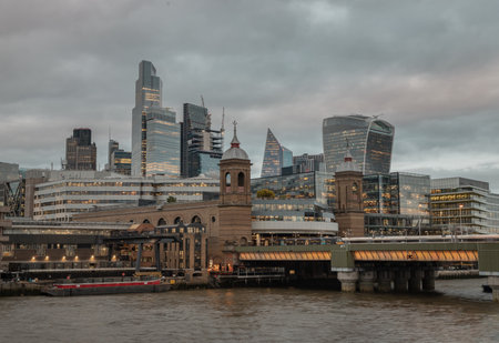 London, UK - Feb 27, 2024 - Beautiful view of Skyscrapers and The cannon street railway bridge in the business district Looking through Southwark bridge over River thames in city of london. Architectural modern buildings, Space for text, Selective Focus.のeditorial素材