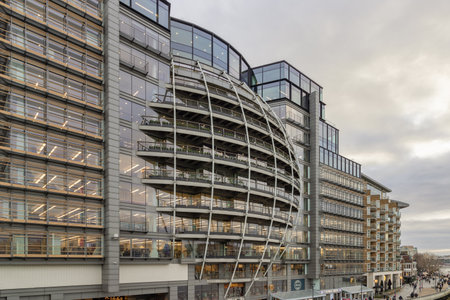 London, UK - Feb 27, 2024 - Modern architectural design of Riverside House. Exterior detail of Curved building along the River Thames of the City of London. Space for text, Selective focus.のeditorial素材