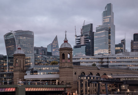 London, UK - Feb 27, 2024 - Beautiful view of Skyscrapers and The cannon street railway bridge in the business district Looking through Southwark bridge in city of london. Architectural modern buildings, Copy space, Selective Focus.のeditorial素材