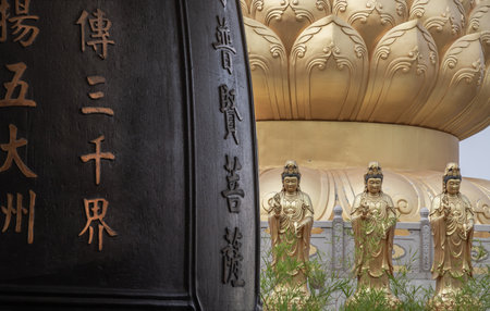 Bangkok, Thailand - Apr 11, 2024 - Chinese lettering on Traditional Chinese Big drum and Golden statue goddess of Mercy Guanyin or Quan Yin statue on background at Fo Guang Shan Thaihua Temple. Space for text, Selective focus.のeditorial素材