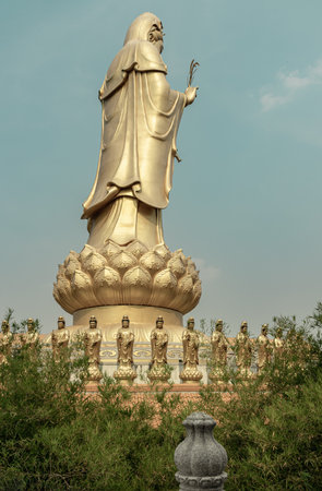 Bangkok, Thailand - Apr 11, 2024 - Big Golden statue goddess of Mercy Guanyin or Quan Yin statue at Fo Guang Shan Thaihua Temple. Guan Yin Buddha, Taiwanese temple style, Copy space, Selective focus.のeditorial素材