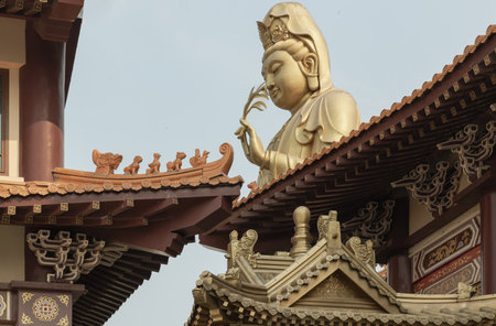 Bangkok, Thailand - Apr 11, 2024 - Big Golden statue goddess of Mercy Guanyin or Quan Yin statue at Fo Guang Shan Thaihua Temple. Guan Yin Buddha, Taiwanese temple style, Copy space, Selective focus.のeditorial素材