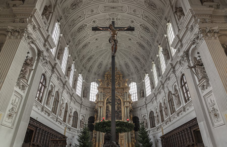 Munich, Germany - Dec 21, 2023 - Jesus hanging on the cross, Crucifix in the interior of St....