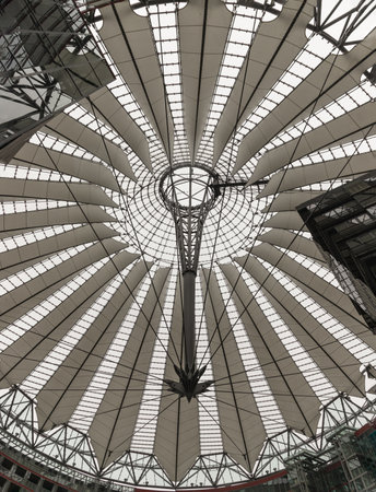 Berlin, Germany - Dec 19, 2023 - Glass ceiling of The Sony center is a building complex located at the Potsdamer Platz square. Construction of Futuristic rumbrella-like tent roof is Contemporary architecture in the district Tiergarten, Berlin-Mitte. Ellipのeditorial素材