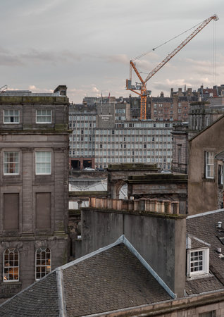 Edinburgh, Scotland - Jan 19, 2024 - View of urban brick buildings and Leonardo royal hotels with sky background in central Edinburgh. Destinations in Europe, Space for text, Selective focus.のeditorial素材