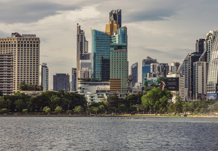 Bangkok, Thailand - 22 Jun, 2024 - Cityscape office buildings with modern architecture. Picturesque view of skyscrapers and dramatic sky before sunset, Copy space, Selective focus.のeditorial素材